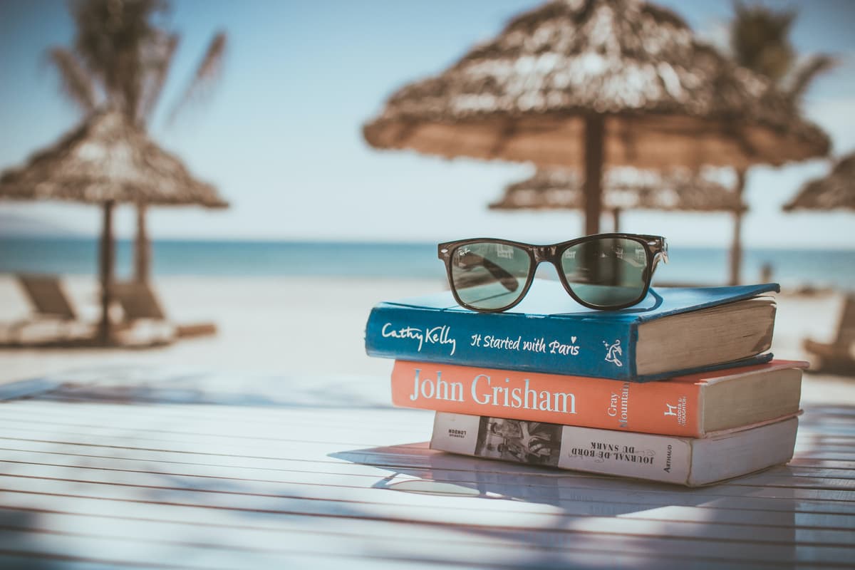 Books & sunglasses on table at the beach